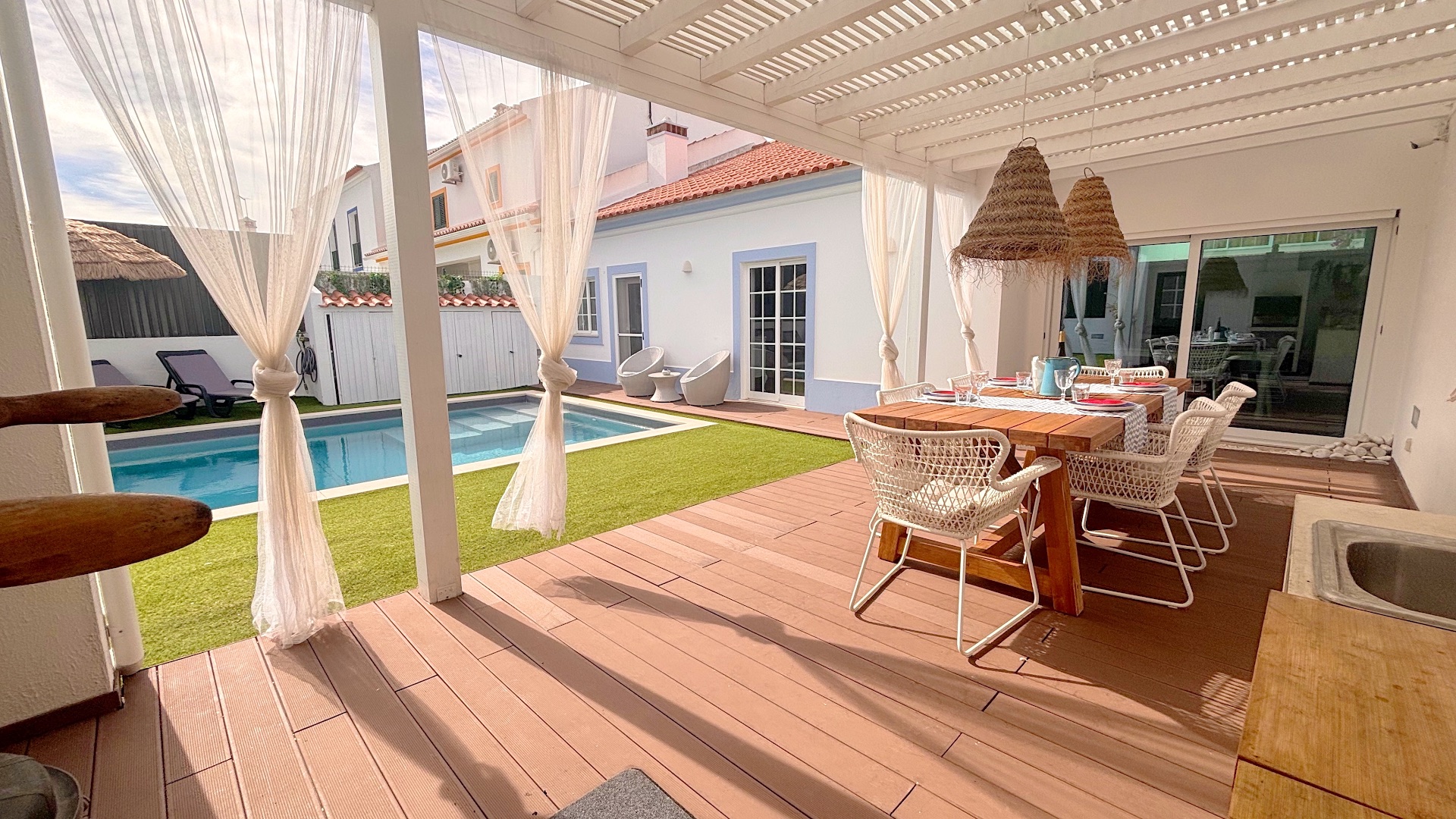 Pergola dining area opening to pool deck