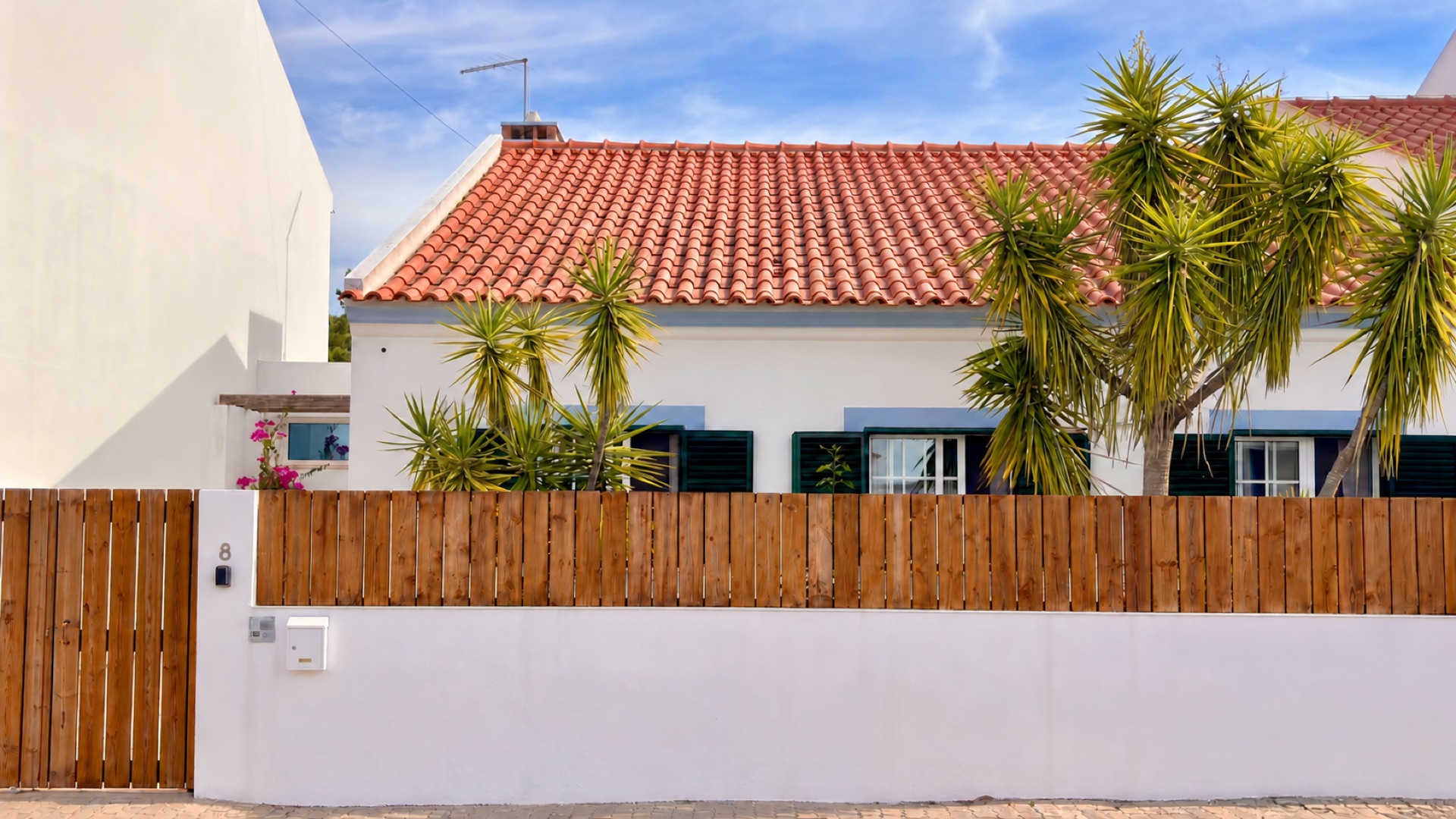 Front exterior façade and wooden fence